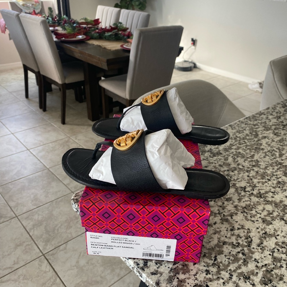 Gently worn Black and Brass Tory Butch sandals in size 9.5. Comes with box.
